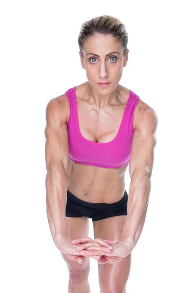 Vrouwelijke bodybuilder met handen samen — Stockfoto