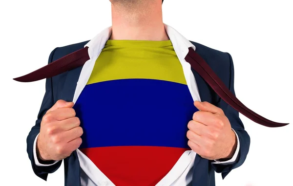 Camisa de apertura hombre de negocios para revelar bandera de Colombia —  Fotos de Stock