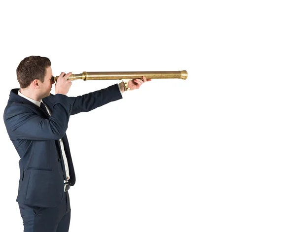 Businessman looking through telescope — Stock Photo, Image