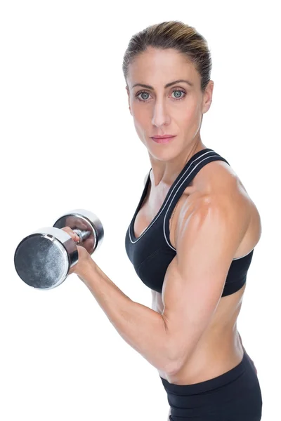 Vrouwelijke bodybuilder bedrijf halter — Stockfoto