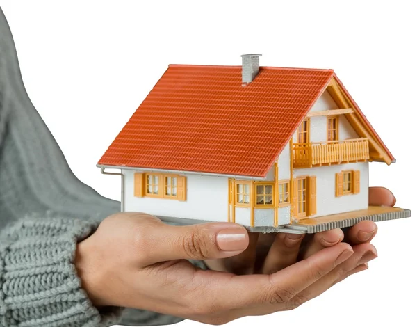 Hands showing a miniature model home — Stock Photo, Image