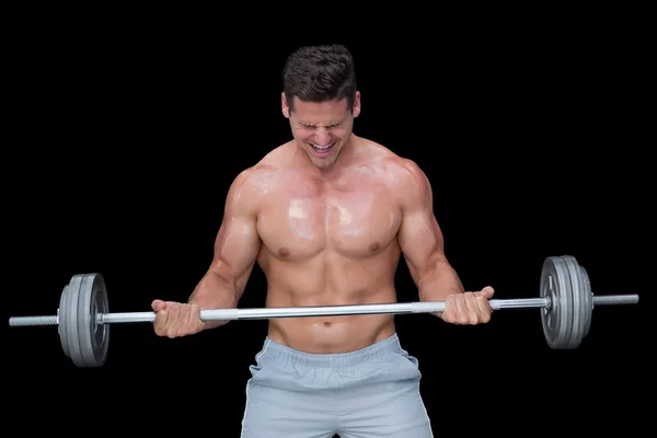 Strong crossfitter lifting up dumbbell — Stock Photo, Image