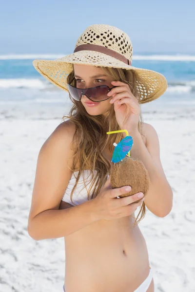 Blonde holding coconut drink — Stock Photo, Image