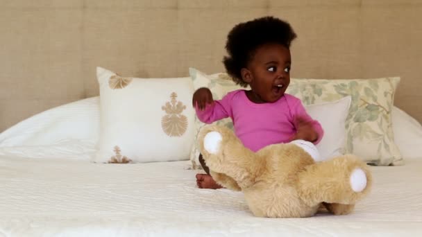 Baby girl playing with teddy bear — Stock Video