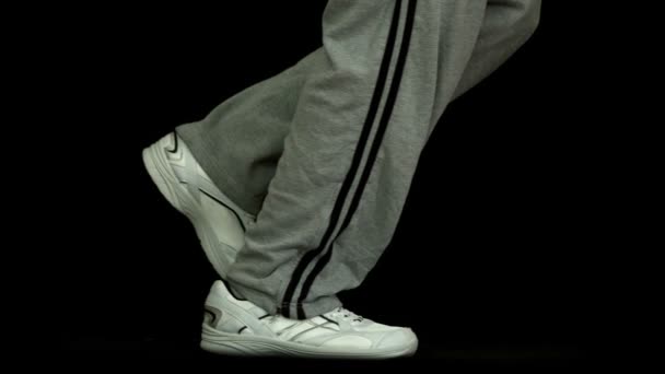 Legs in tracksuit running — Stock Video