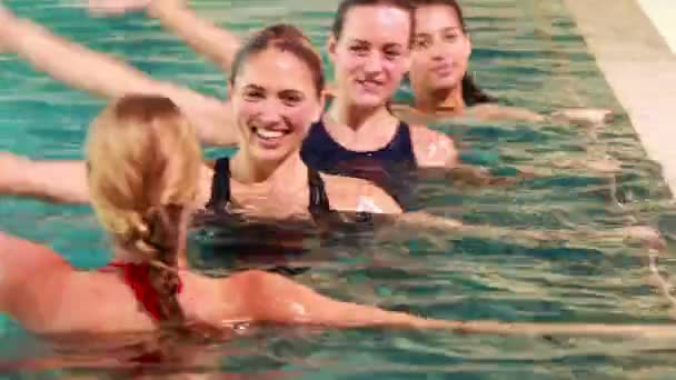 Fit women doing aqua aerobics in the pool — Stock Video