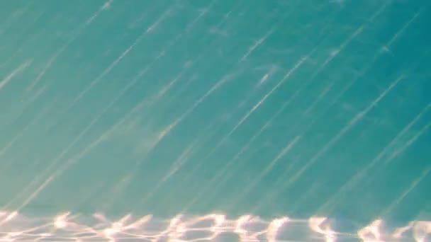 Light shining into blue swimming pool — Stock Video