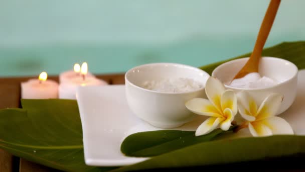 Beauty treatments in bowls poolside with flowers — Stock Video