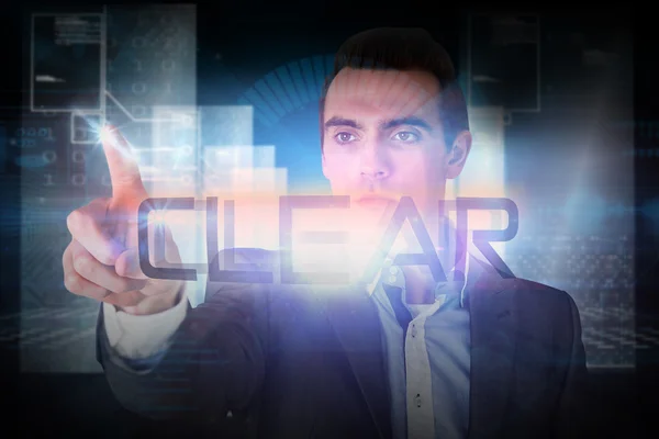 Businessman pointing to the word clear — Stock Photo, Image