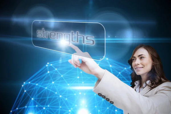 Businesswoman pointing to word strengths — Stock Photo, Image