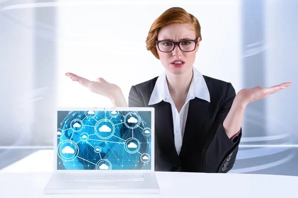 Businesswoman holding hand out in presentation — Stock Photo, Image