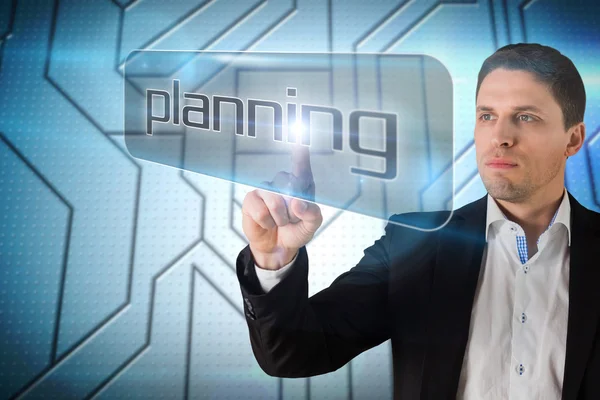 Affärsman som pekar till ordet planering — Stockfoto