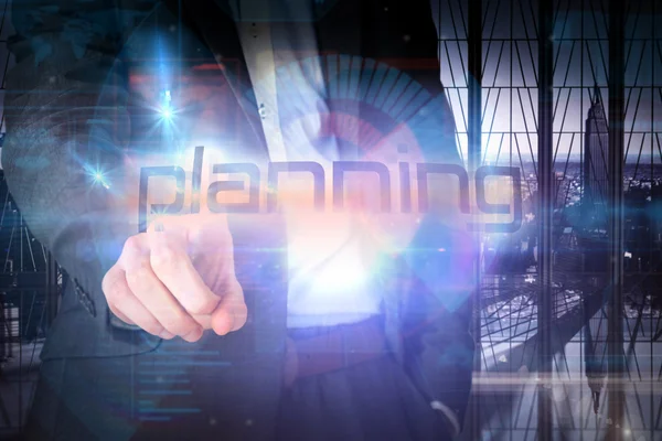 Businessman presenting the word planning — Stock Photo, Image
