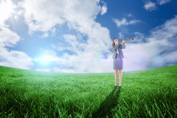 Businesswoman looking through telescope — Stock Photo, Image