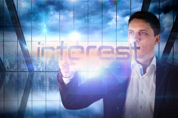 Businessman presenting the word interest — Stock Photo, Image