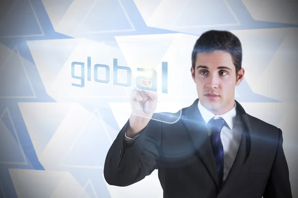 Businessman pointing to word global — Stock Photo, Image
