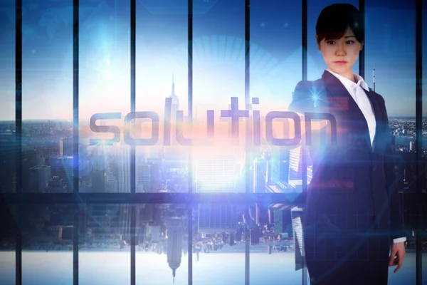 Businesswoman presenting the word solution — Stock Photo, Image