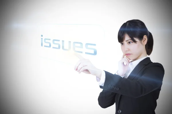 Businesswoman pointing to word issues — Stock Photo, Image