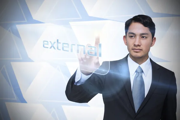 Businessman pointing to word external — Stock Photo, Image