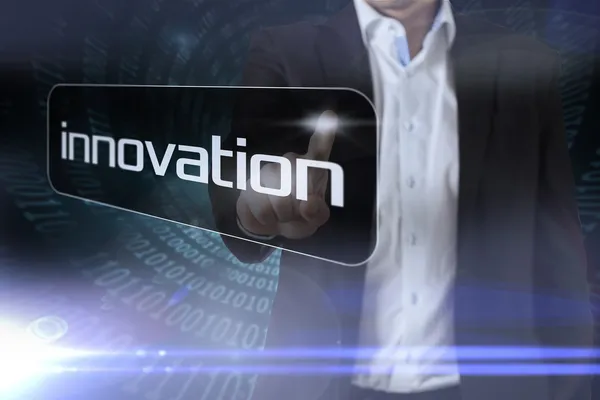 Businessman pointing to word innovation — Stock Photo, Image