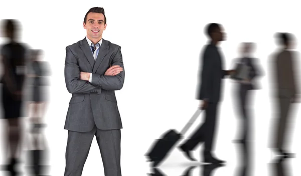 Businessman against silhouettes of business people — Stock Photo, Image