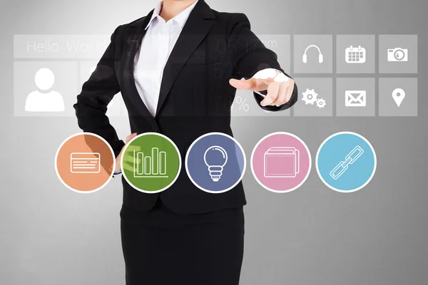Mujer de negocios apuntando a los botones de aplicaciones de negocios —  Fotos de Stock