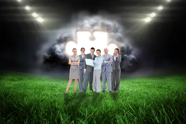 Business team against football pitch — Stock Photo, Image