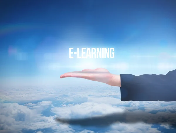 Businesswomans hand presenting  word e learning — Stock Photo, Image