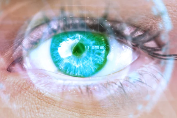 Composite image of close up of female blue eye — Stock Photo, Image