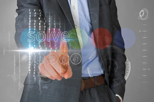 Businessman touching the word solve on interface — Stock Photo, Image