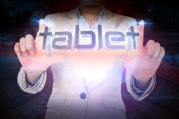 Businesswoman presenting the word tablet — Stock Photo, Image