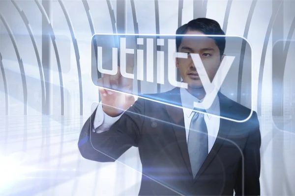 Businessman presenting the word utility — Stock Photo, Image