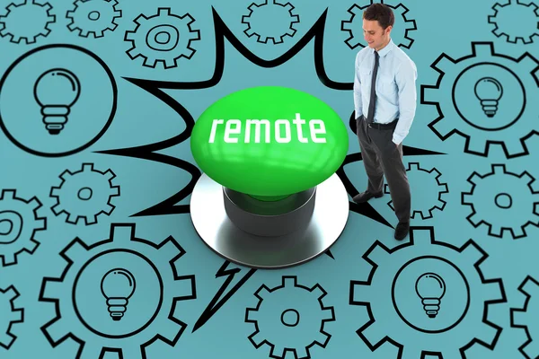 Remote against digitally generated green push button — Stock Photo, Image