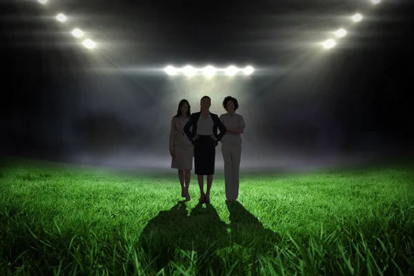 Businesswomen against football pitch — Stock Photo, Image