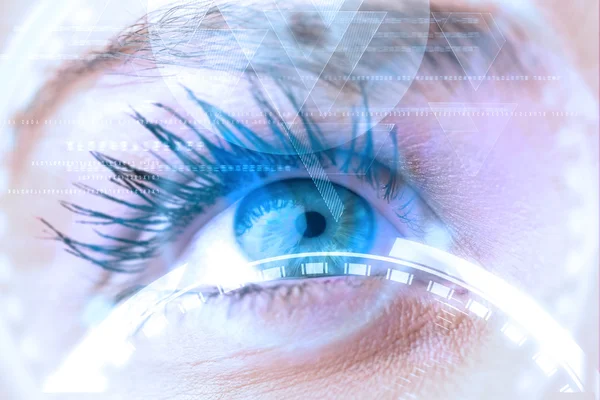 Composite image of close up of female blue eye — Stock Photo, Image