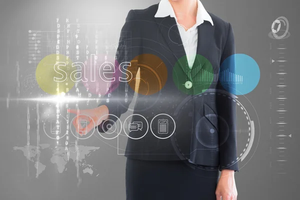 Zakenvrouw aanraken het woord sales op interface — Stockfoto