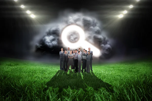 Business team against football pitch — Stock Photo, Image