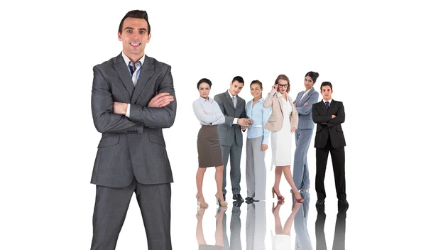 Businessman against group of business people Stock Picture