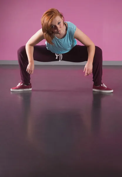 Pretty break dancer posing with legs out — Stock Photo, Image