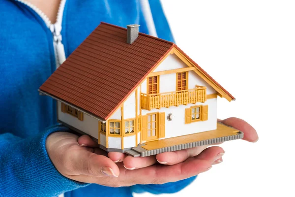 Hands holding miniature house model — Stock Photo, Image