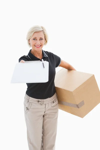 Happy delivery woman looking for signature — Stock Photo, Image