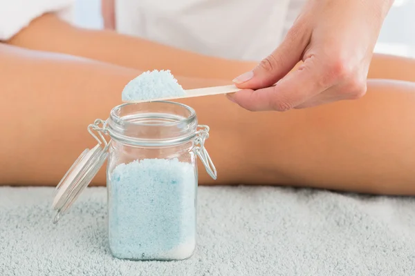 Close up of a hand using salt scrub — Stock Photo, Image