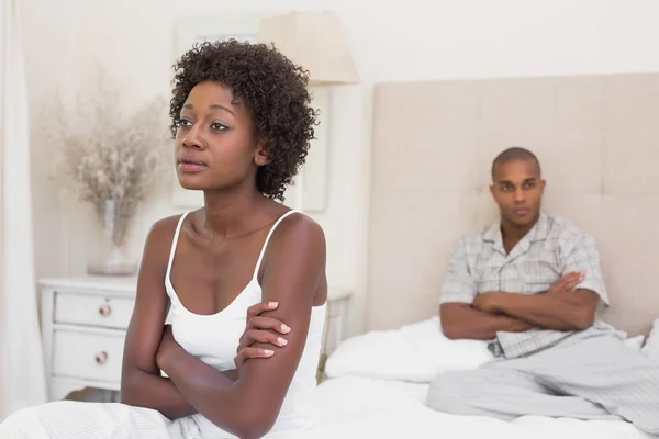 Unhappy couple not speaking to each other on bed — Stock Photo, Image