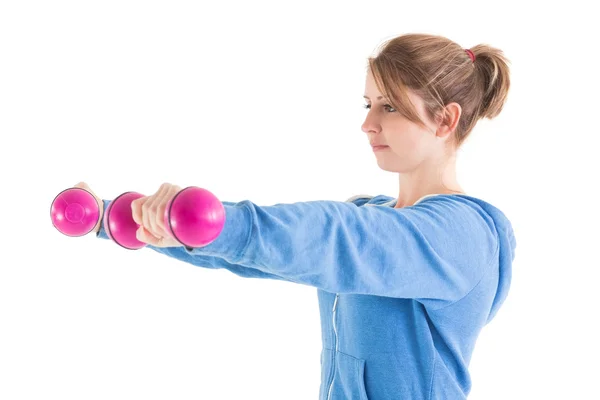 Young woman exercising with dumbbells — Stock Photo, Image