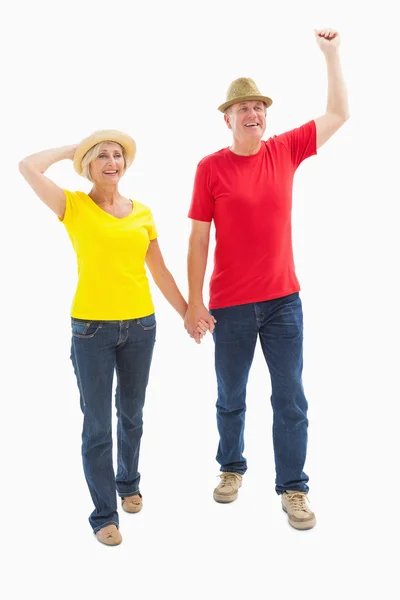 Mature couple walking and holding hands — Stock Photo, Image