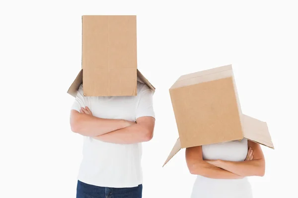 Mature couple wearing boxes over their heads — Stock Photo, Image
