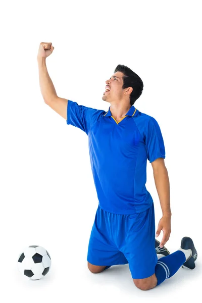 Happy football player in blue celebrating — Stock Photo, Image