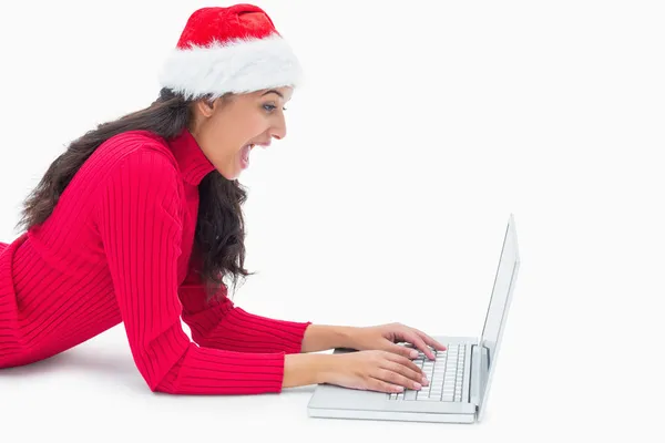 Beautiful festive woman typing on laptop — Stock Photo, Image