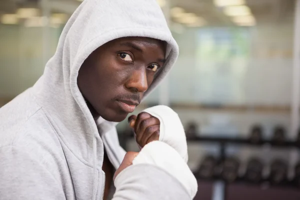 Boxer in hood jacket at health club — Stock Photo, Image