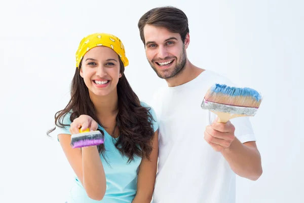Happy young couple painting together — Stock Photo, Image